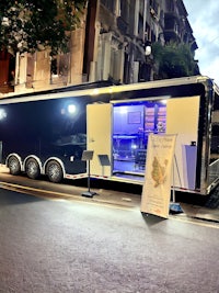 a black and white truck parked on the side of a street