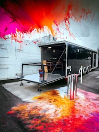 a trailer with a colorful paint splatter on it